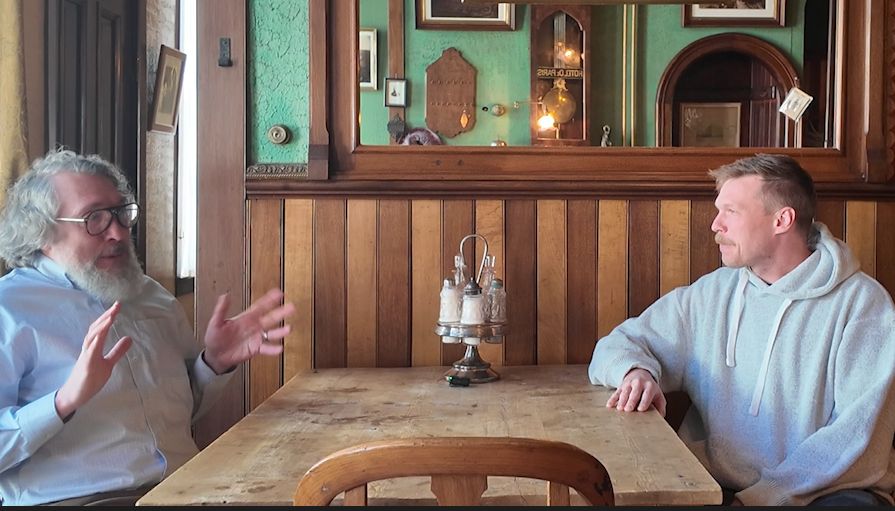 Kevin Kuharic director of the museum talks with Derek Schulze