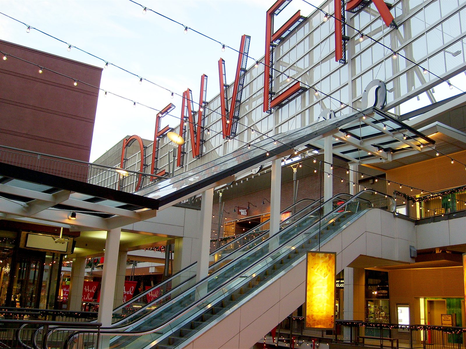 "Denver Pavilions sign and escalators" by Dave Friedel is licensed under CC BY 2.0.