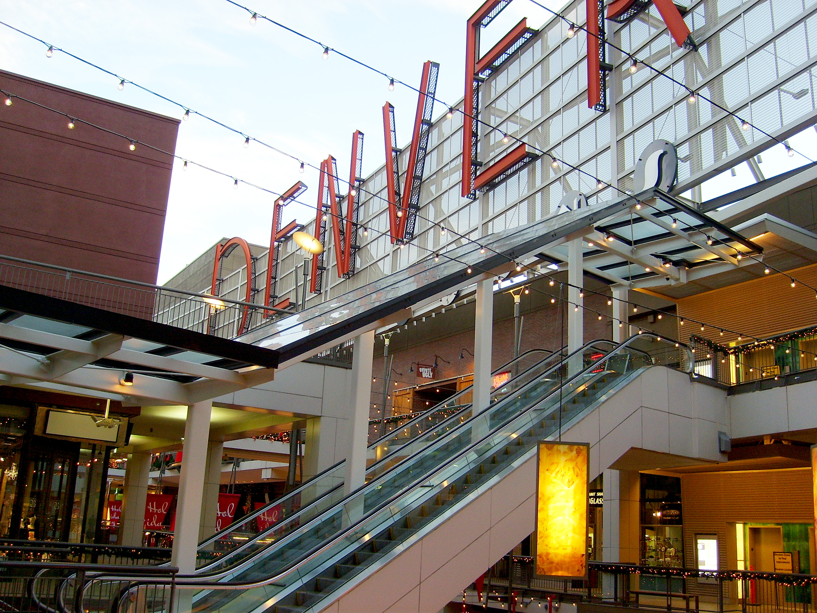 "Denver Pavilions sign and escalators" by Dave Friedel is licensed under CC BY 2.0.