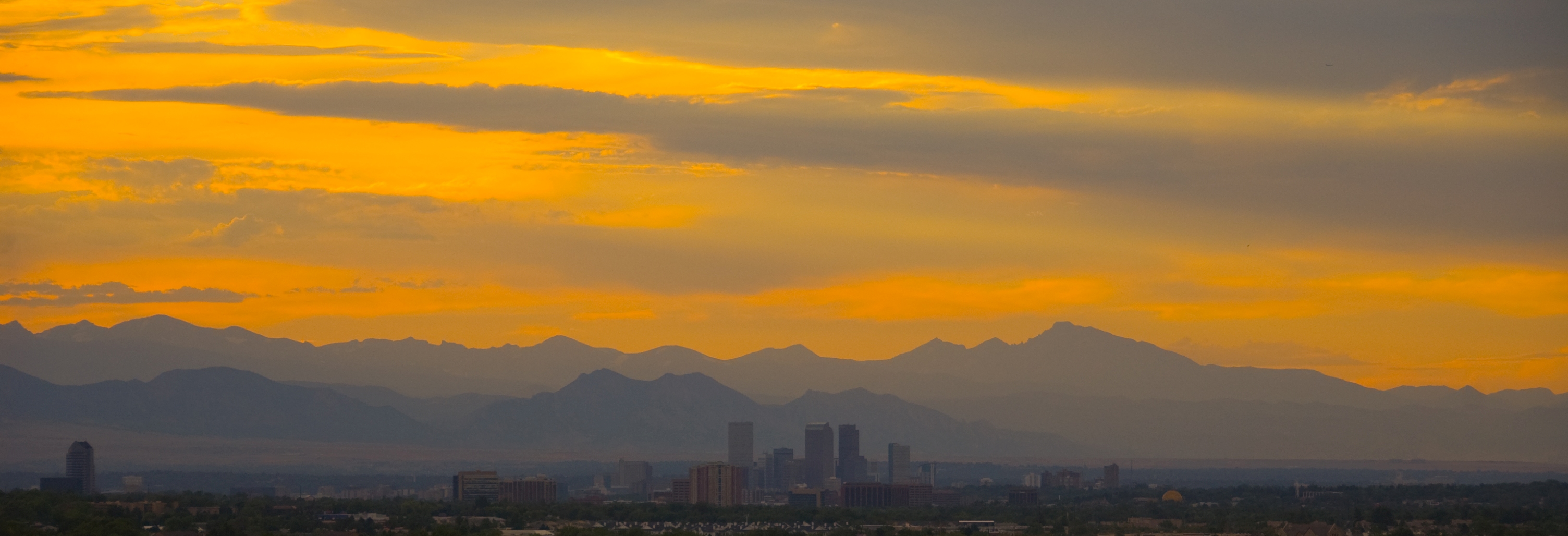 "Downtown Denver Skyline at Sunset" by DarlArthurS is licensed under CC BY 4.0.