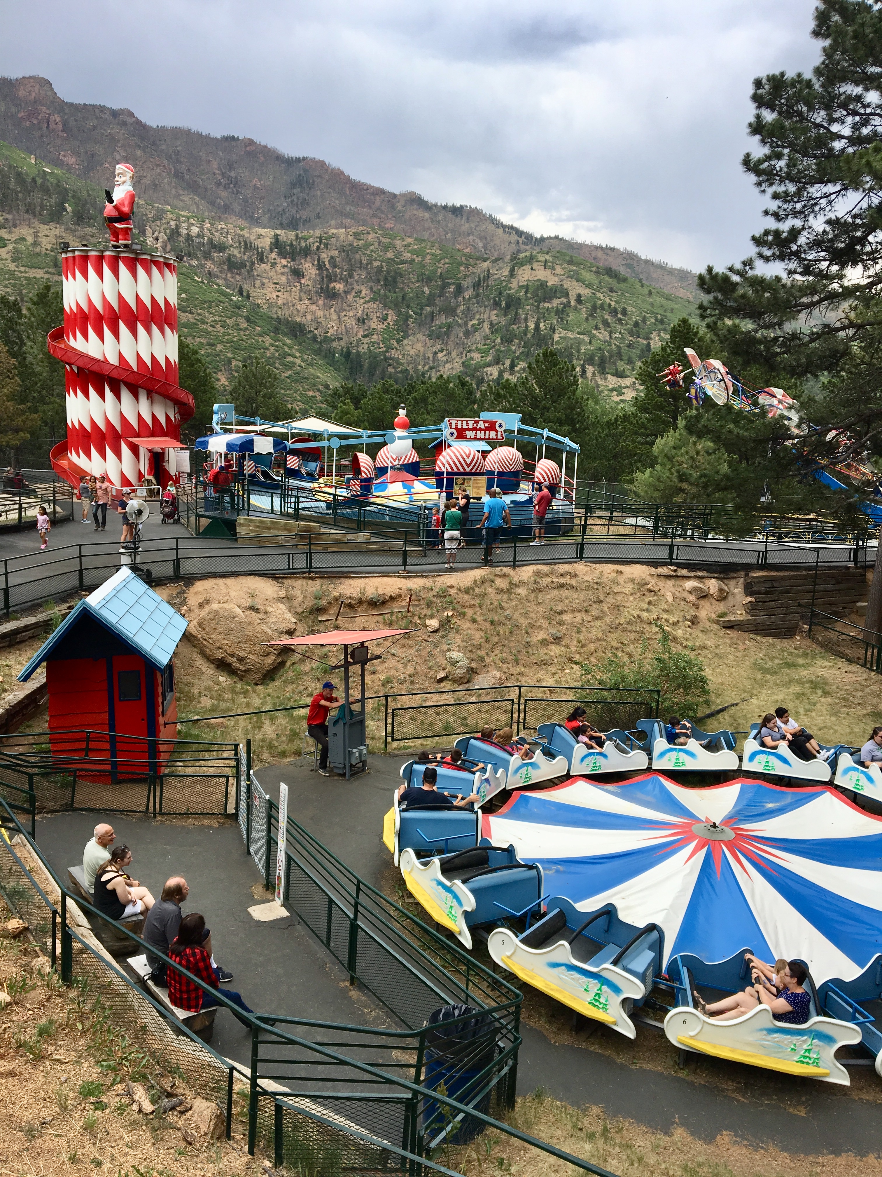 Cascade amusement park nestled below the towering mountain's slopes