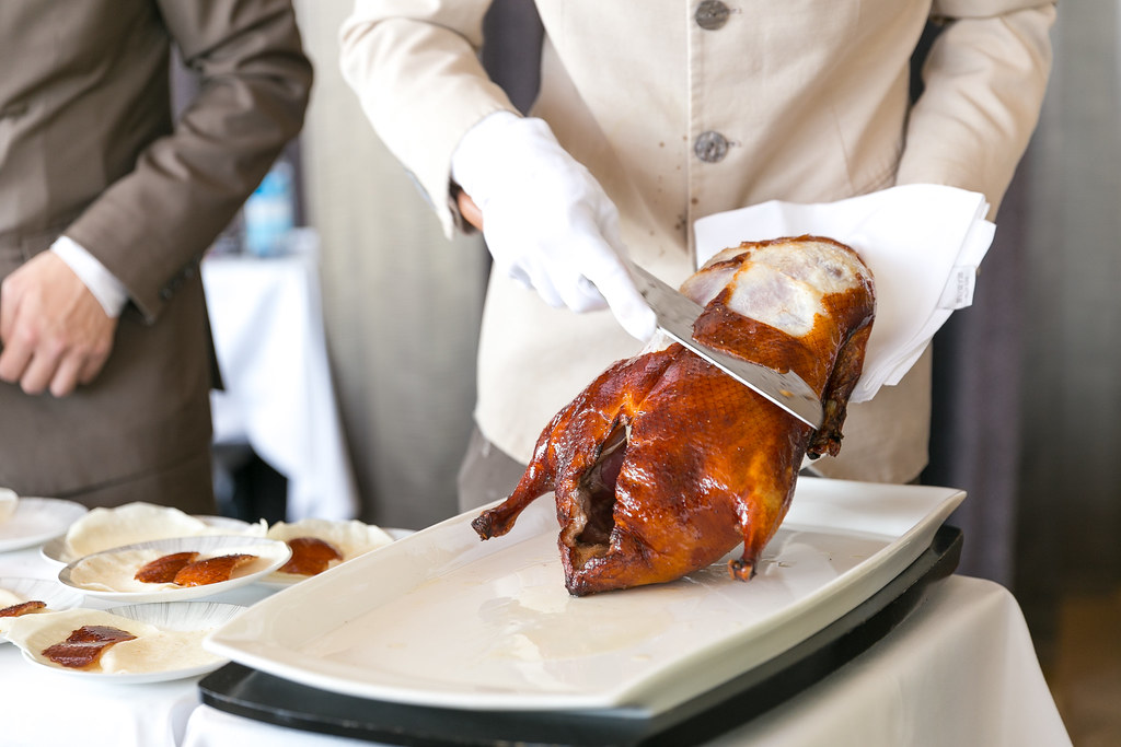 "Cutting the Peking Duck skin tableside" by City Foodsters is licensed under CC BY 2.0.