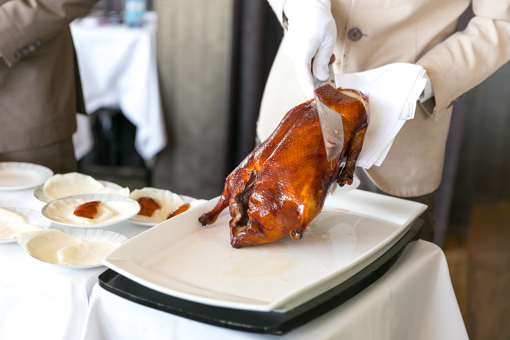 "Cutting the Peking Duck skin tableside" by City Foodsters is licensed under CC BY 2.0.