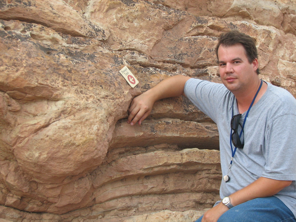 "Sauropod dinosaur track in sandstone (Morrison Formation, Upper Jurassic; western side of Dinosaur Ridge, Colorado, USA) 4" by James St. John is licensed under CC BY 2.0.