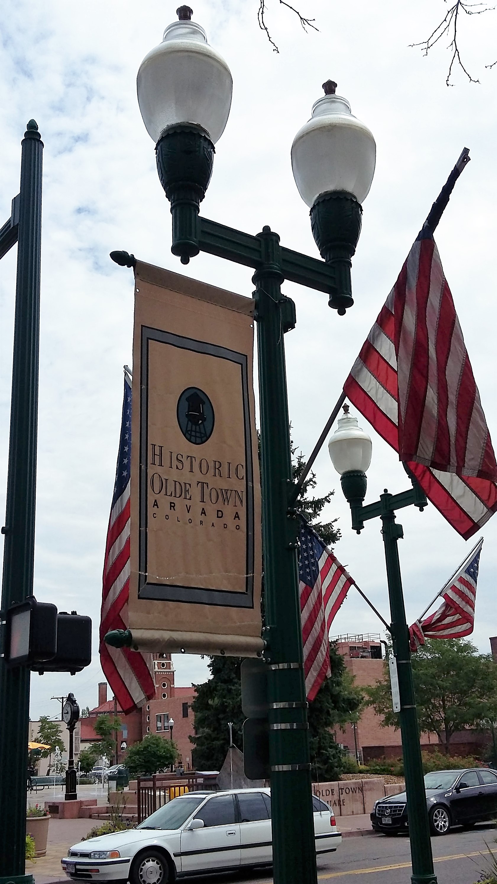 "File:Historic Olde Town Arvada Colorado streetlight banner & flags.jpg" by Xnatedawgx is licensed under CC BY-SA 4.0.
