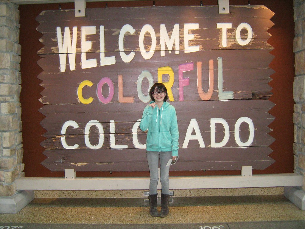 "Laurel with the welcome sign in the History Colorado Center" by oddharmonic is licensed under CC BY-SA 2.0.