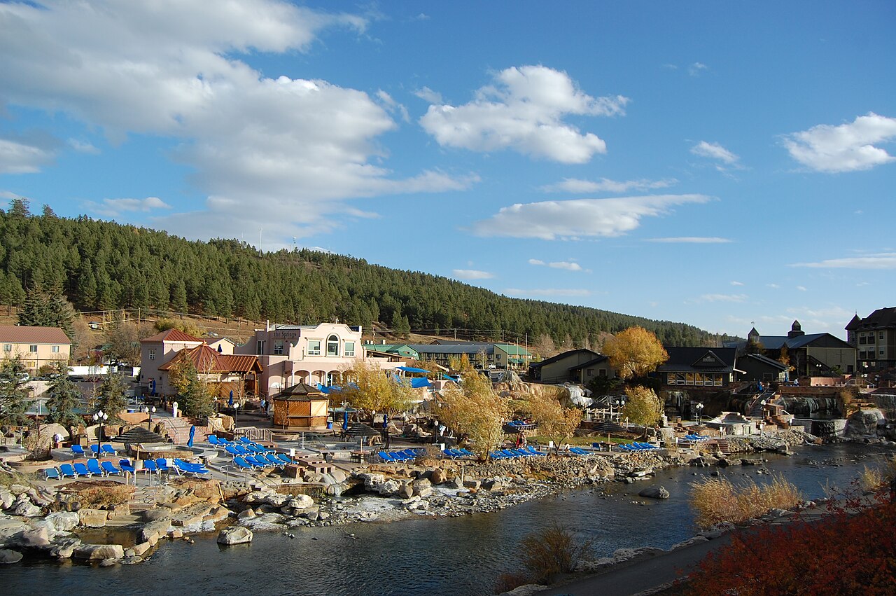 Steaming hot springs pools overlook the San Juan River downtown