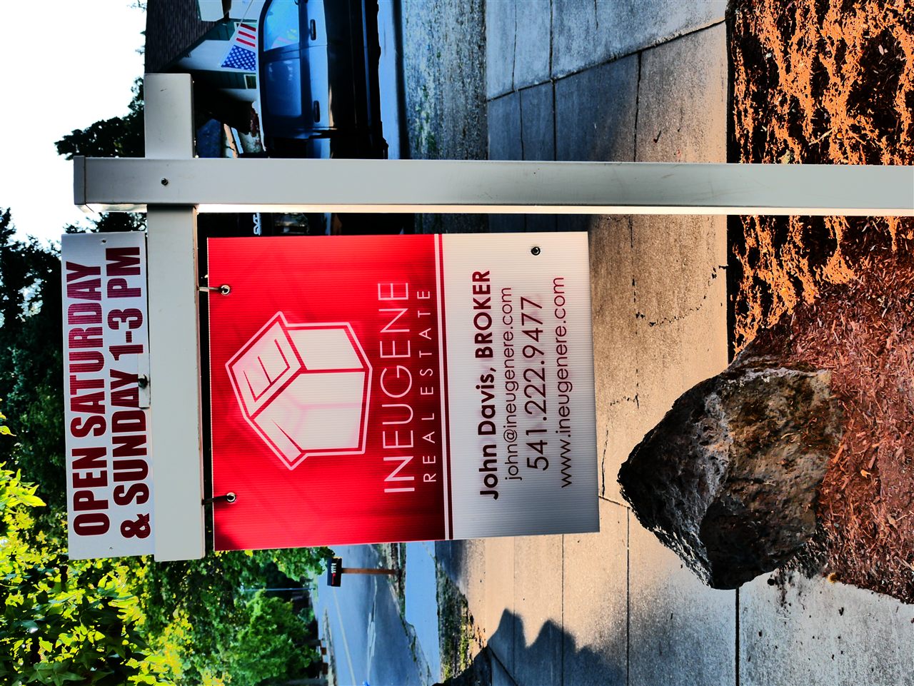 For-sale and open-house signs outside a home.